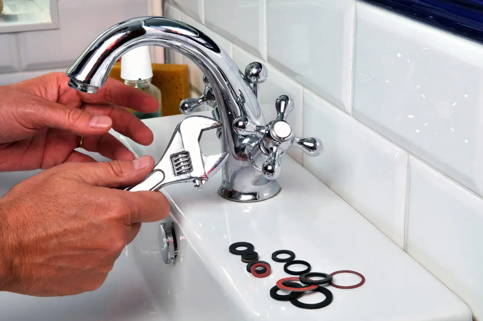 Plumber maintaining a bathroom faucet in Inglewood