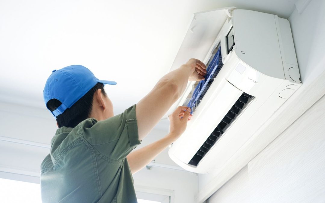 HVAC technician servicing a ductless mini split in Inglewood