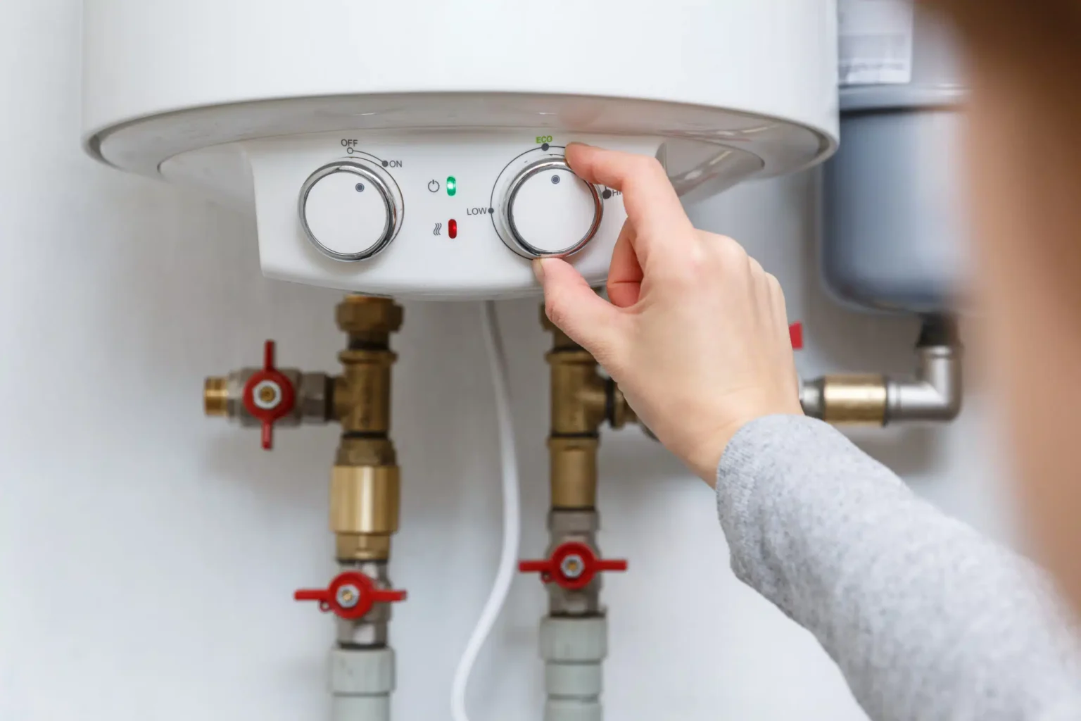 Technician adjusting a water heater in Inglewood